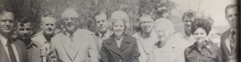 Vintage photo of individuals preparing for the ground breaking of the first location of south georgia banking company location in Omega, georgia.